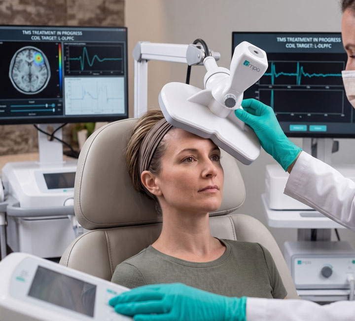 A young woman getting accellerated TMS therapy in West Palm Beach at Hope Therapeutics